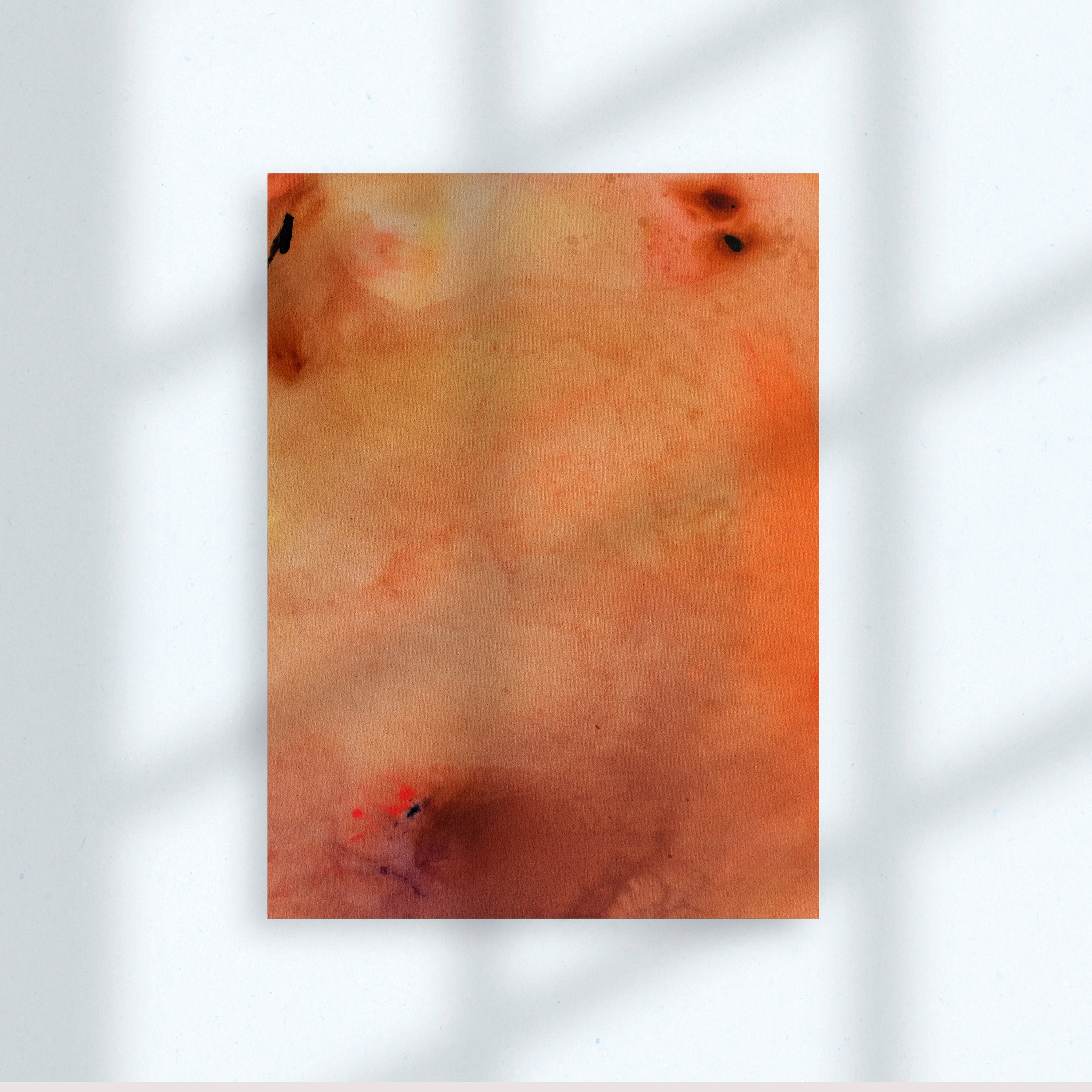 Orange abstract painting hangs on a white wall with window pane shadows falling on top.